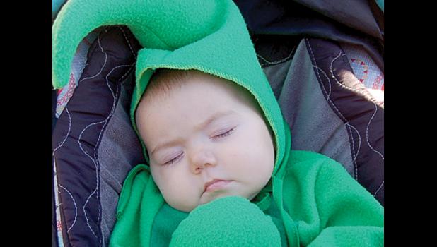 Staff Photo by Scott Thoma. Apparently, the sights or sounds of Trunk or Treat on Saturday didn't interest five-month-old Olivia Myhre, who took the opportunity to catch a quick nap in her peapod costume.