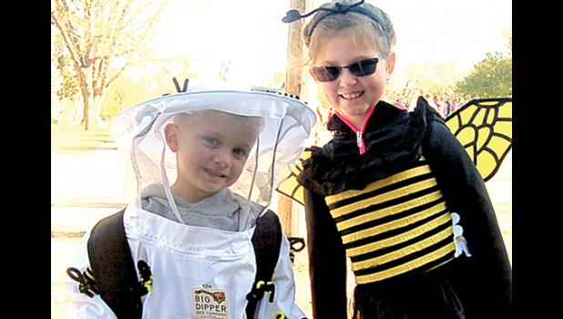 Staff Photo by Scott Thoma. Beekeeper Titan Fier, left, and his sister Talia Fier, who was a bee, found Trunk or Treat to be a honey of an event.