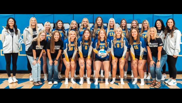 The 2026 Minneota varsity volleyball team. Back row, left to right: Assistant coach Shelby Domeier, assistant coach Ireland Stassen, Madison Minnehan, Sydney Hennen, Libby Sussner, Jaylyn Coequyt, Leah Coequyt, Grace Horner, Sophie Gillund, Brek Fier, Elise Hennen, head coach Kaley Buysse, assistant coach Emily Citterman. Front row, left to right:  Brooklyn Ryer, Kaylee Schmidt, Ava Rost, Eden Meagher, Autum Anderson, Brynn Rost, Niara Gorecki, Addy Kiley. Mascot photo by Brian Jeremiason
