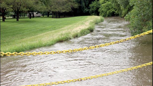 Staff Photo by Byron Higgin. The already saturated Yellow Medicine River in Minneota was again nearing bridge level.