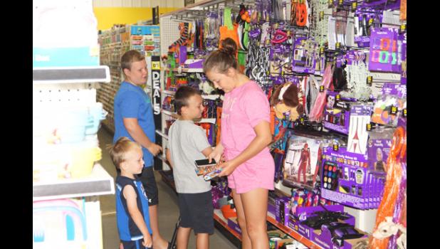 Photo for the Mascot by Sue Jacobson. Aiden, Caleb, Emma and Noah Bottelberghe of Minneota wanted to explore the new store.