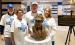 Gerhard and Nancy Meidt’s children posed with the bronze bust of their father on Friday. Left to right: Greg Meidt, Karen Meidt, Chris Meidt and Melody (Meidt) Leidall.