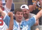 Austin Buysse showed off after catching the ball at the College World Series. Mudhen Manager Tyson Sonnenburg was behind him.
