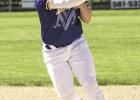 Adam Dalager of Minneota throws a Tracy-Milroy-Balaton runner out at first base last Thursday in Minneota. 