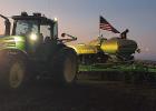 Adam DeCock inspects his corn planter after a long day of planting north of Minneota last Tuesday, April 22. 