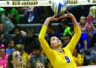 You might call this a "Frie Flicker". Abby Frie flicked the ball backwards over her head to the other side of the net.