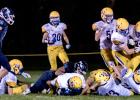 MINNEOTA'S GOAL LINE STAND came with Payton Hess buried by Minneota tacklers.
