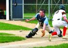 Jake Leighton scored a run as Madison catcher Matt Enger waited for the ball (left) to arrive.