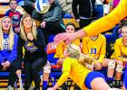 Lizzy Gillingham dove for the ball in front of Coach Hayley Fruin and her bench at Canby Tuesday night