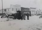 A downtown scene of Minneota workers clearing off the street following a winter storm in the early 1940s.
