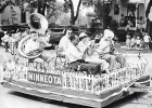 Several members of the The Minneota Community Band rode on a float during the 1952 Belgian-American Days parade. Left to right: Jim DeCock, Pat Haas, Leonard Allen and Katherine (Sanders) Van Watermeulen. The man on the right shielded by his horn is unknown.