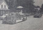 Taunton's 1949 Fourth of July parade drew a large crowd. A morning parade included fire trucks from Minneota and Taunton, several horses either with riders or pulling wagons, and several floats. The float in the foreground was entered by Beck Hardware and the trailing one was entered by Peavey Elevator.