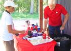 Kevin Anundson, right, of State Farm Insurance served up a root beer float to Bekkem Gillund on Sunday. Anundson offered free floats to fans of both teams in attendance for the Minneota Mudhens game against the Morris Eagles on Sunday at K.P. Kompelien Field.