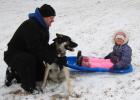  Koda, a Siberian Husky/German Shepherd mix takes a break with Joel Walerius and his daughter, Olivia. 