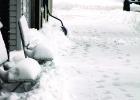 Snow on benches on Jefferson Street.