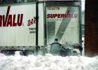 Minneota grocery man Brad Minnehan helped the Super Valu truck back up to his building during the storm on Friday morning.