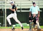 Staff Photo by Byron Higgin Minneota's Tate Walerius crossed home plate with one of the Vultures' runs in a 12-1 win. Granite Falls catcher Cole Fischer got the ball but it was too late.