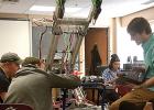 Busy working on the project are (left to right) advisor Justin Buysse, Caleb Sterzinger, Jaymes Moon busy working and Nate Ludwikowski. 