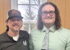 T.J. Esping, right, poses with J.D. Pesch after his induction into the Hall of Fame on Saturday.