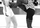Landon Pohlen, left, of Minneota grabs the leg of Salamandra Idris of Sioux Falls Washington before winning their 120-pound match by a technical fall. 