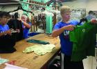 Helping sort clothes were: (left to right) Chloe Davis, Ava Larson and Cole Myhre. 
